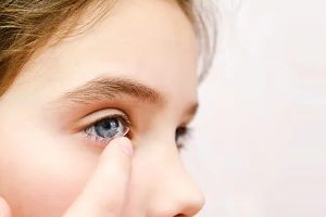 Child wearing contact lenses