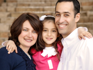Parents with child visiting Eyeson Group for eye care