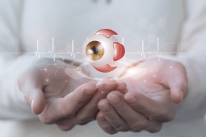 Hands holding a digital 3D rendering of an eyeball, surrounded by medical icons and heartbeat lines, symbolizing eye health